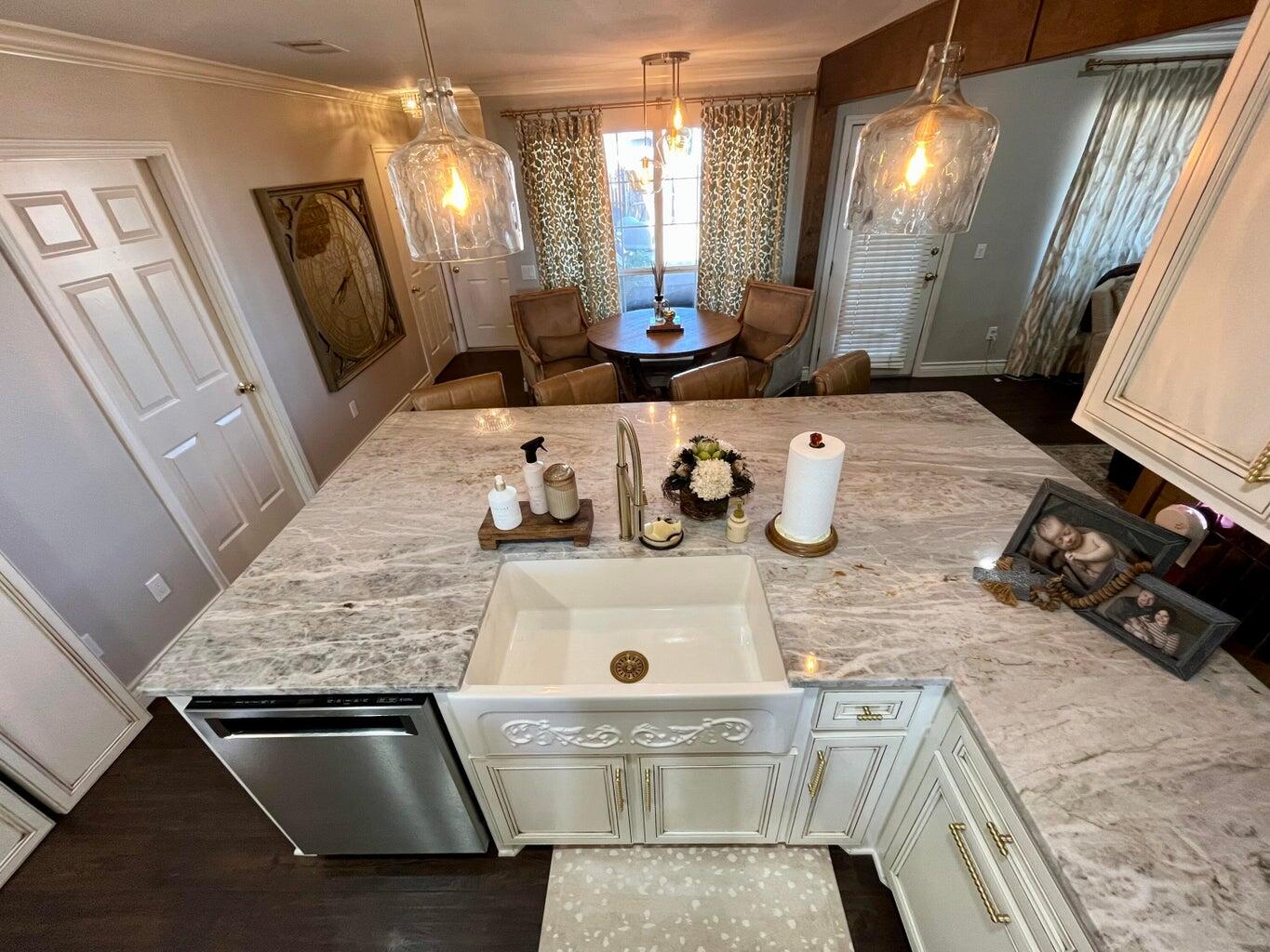 1492 Co Road Hale Center, TX 79041 - Photo 14 of 64 a kitchen with kitchen island granite countertop a sink stove and cabinets