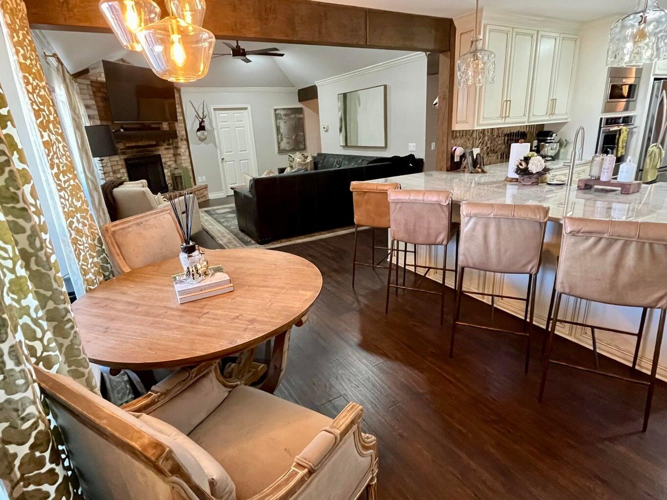 1492 Co Road Hale Center, TX 79041 - Photo 16 of 64 a dining room with furniture and wooden floor
