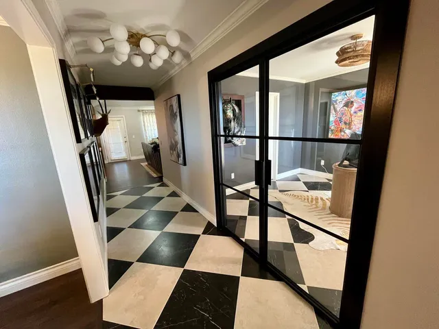 a bathroom with a sink a toilet a mirror and shower curtain