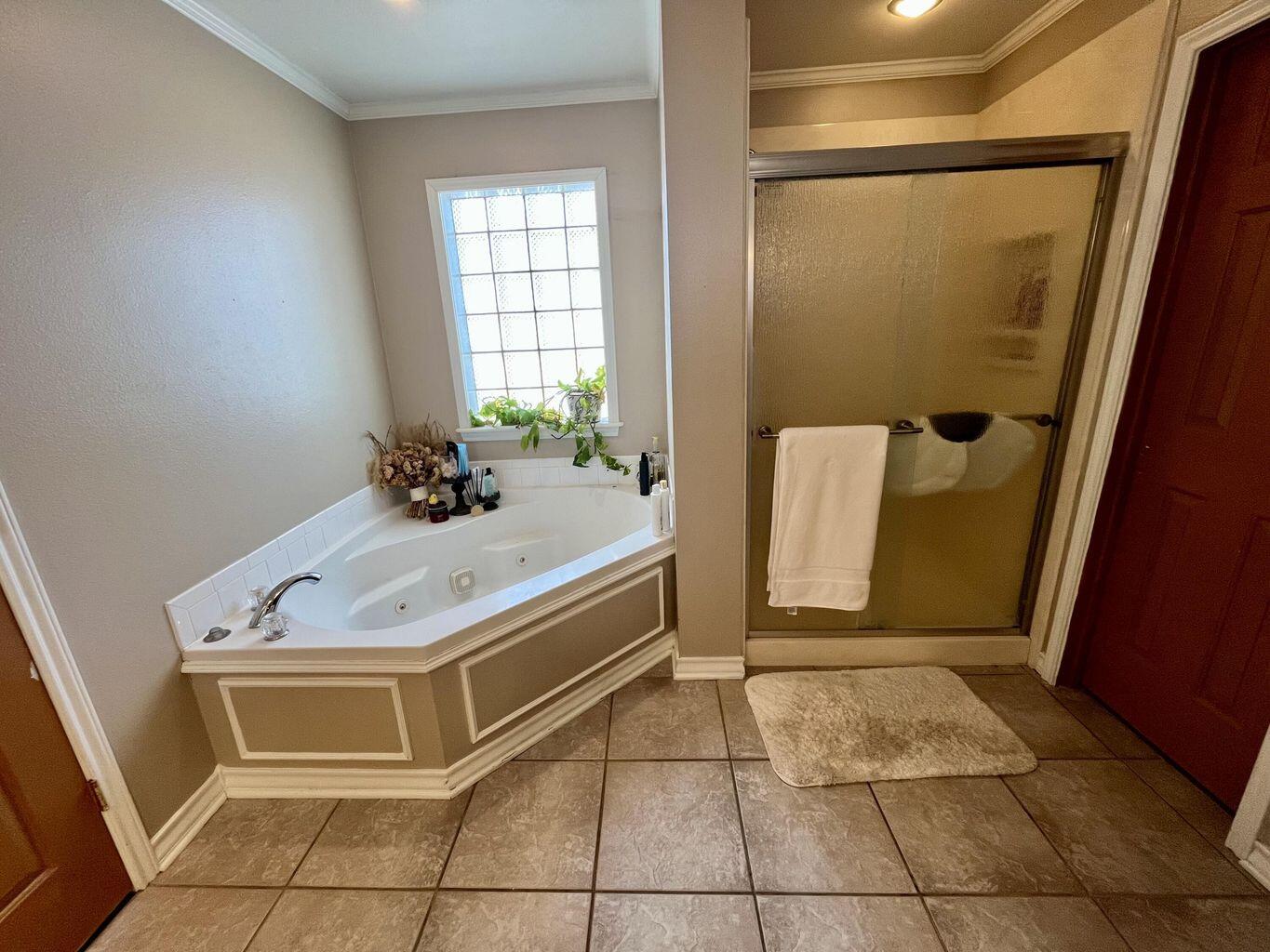 1492 Co Road Hale Center, TX 79041 - Photo 24 of 64 a bathroom with a sink and shower