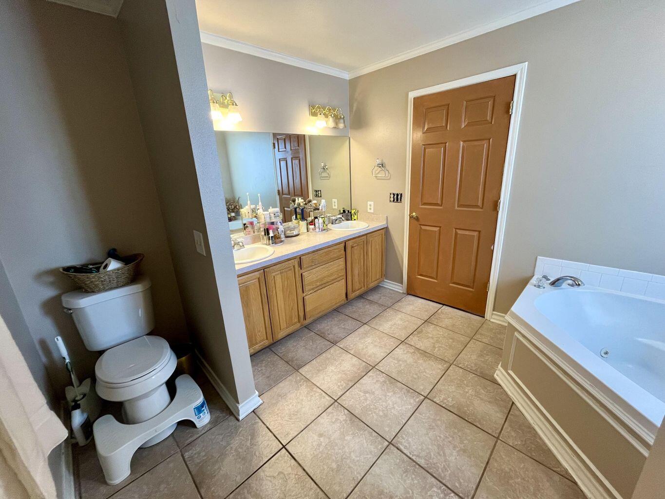 1492 Co Road Hale Center, TX 79041 - Photo 25 of 64 a bathroom with a sink toilet and shower