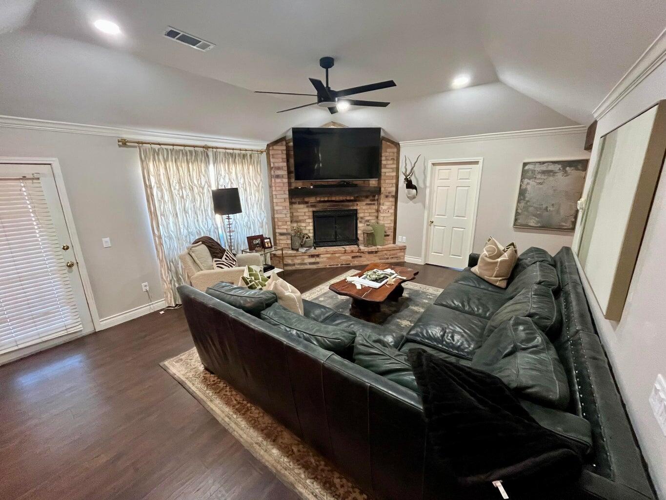1492 Co Road Hale Center, TX 79041 - Photo 5 of 64 a living room with furniture and a flat screen tv