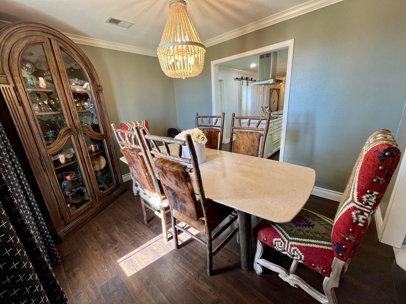 1492 Co Road Hale Center, TX 79041 - Photo 8 of 64 a view of a dining room with furniture and chandelier