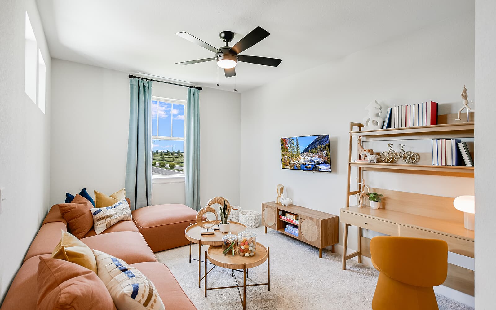 8818 Marmoset Way Austin, TX 78744 - Photo 14 of 19 Living area featuring a ceiling fan and light colored carpet