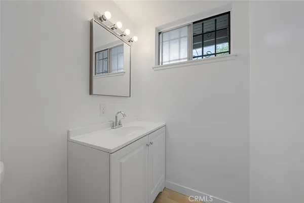 a bathroom with a sink and mirror