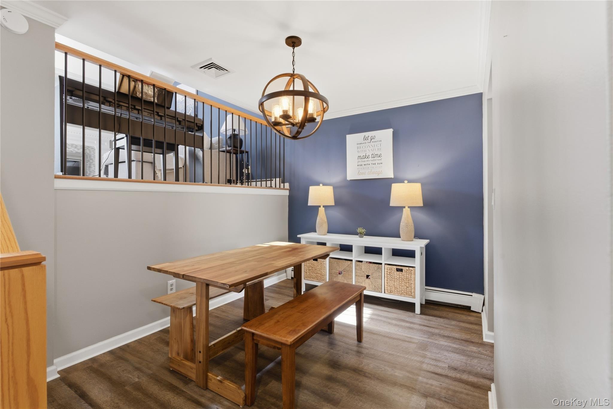 245 Tree Top Crescent Rye Brook, NY 10573 - Photo 5 of 24 a view of a dining room with furniture a chandelier and wooden floor