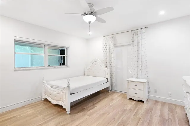 a room with a bed and a window