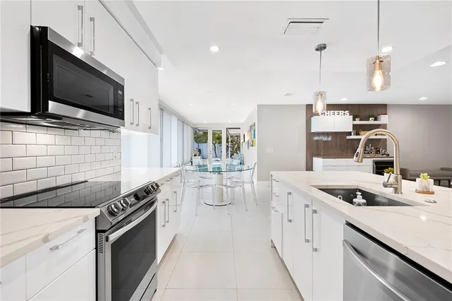 a kitchen that has a microwave and a stove