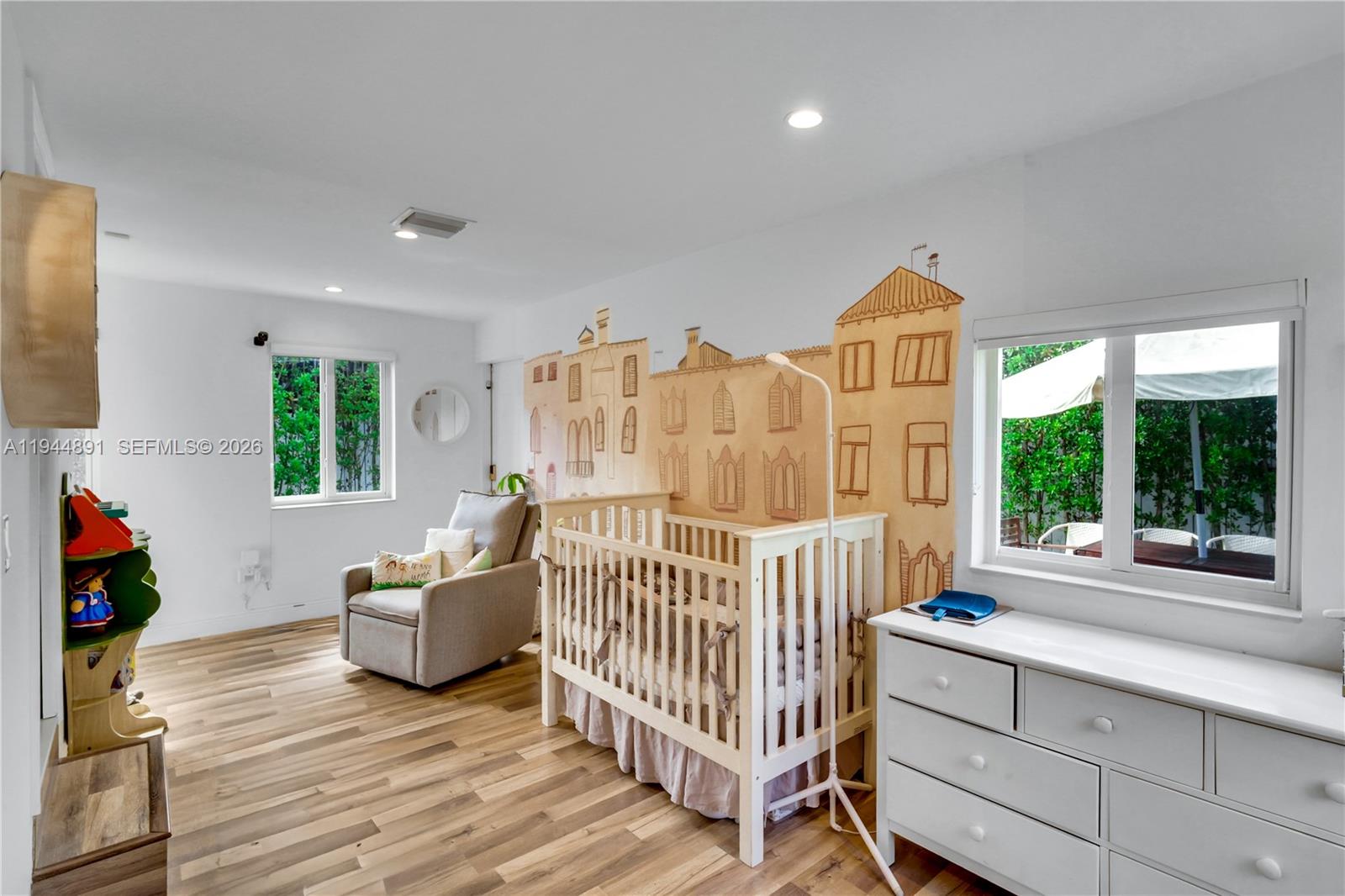 1450 Southwest 20th Avenue Miami, FL 33145 - Photo 18 of 44 a view of a bedroom with furniture and windows