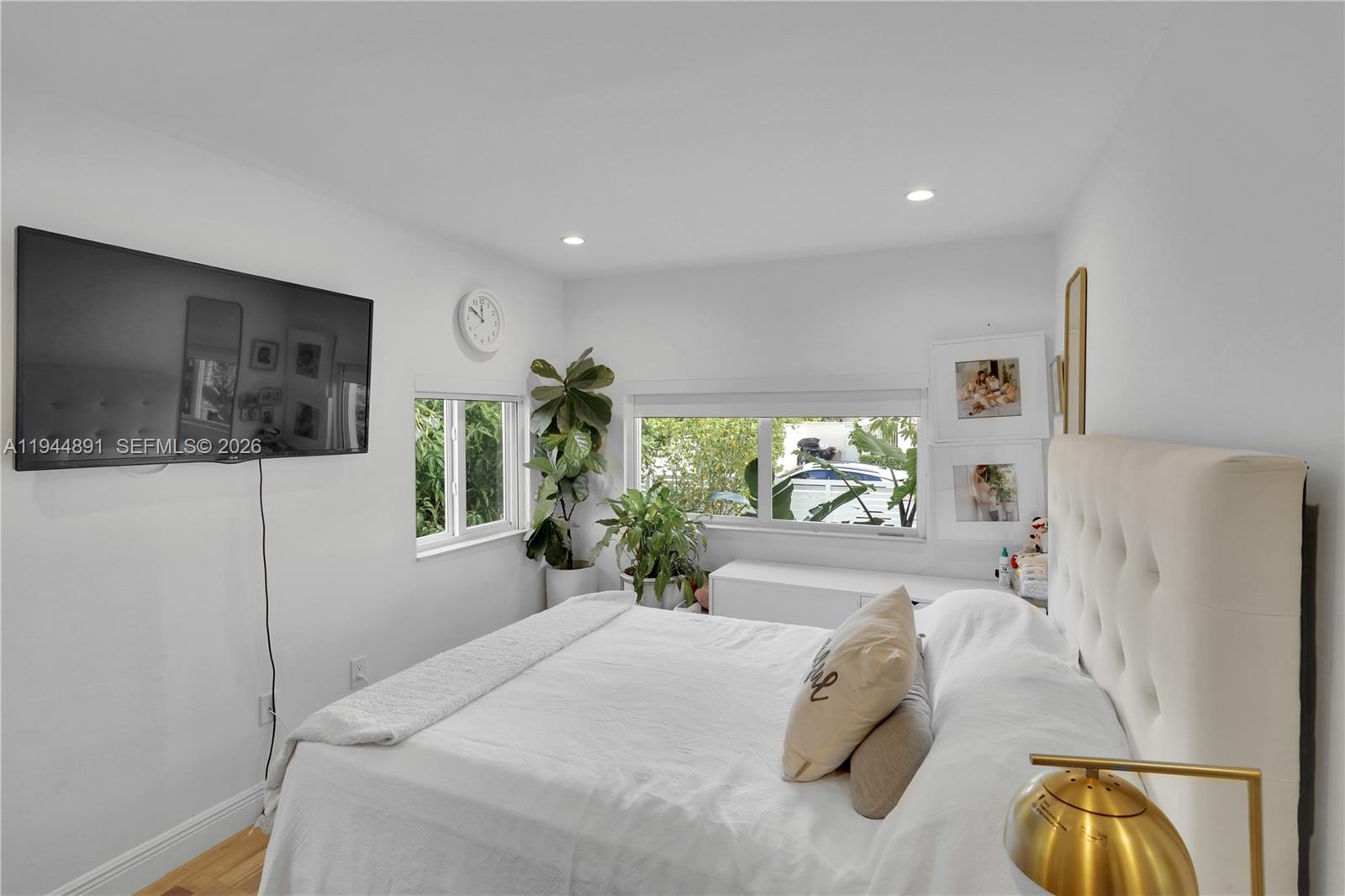 1450 Southwest 20th Avenue Miami, FL 33145 - Photo 29 of 44 a bedroom with a bed and a flat screen tv