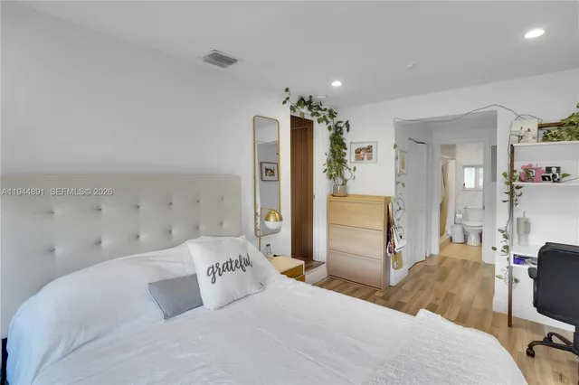 a bedroom with a bed and furniture