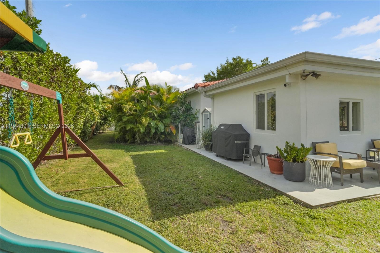 1450 Southwest 20th Avenue Miami, FL 33145 - Photo 41 of 44 a view of a backyard with sitting area