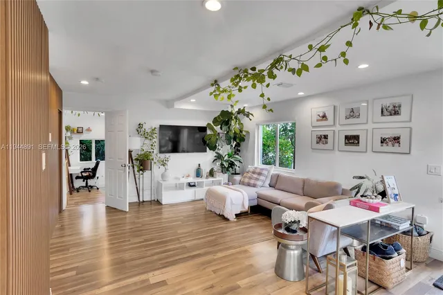 a living room with furniture or wooden floor and a rug