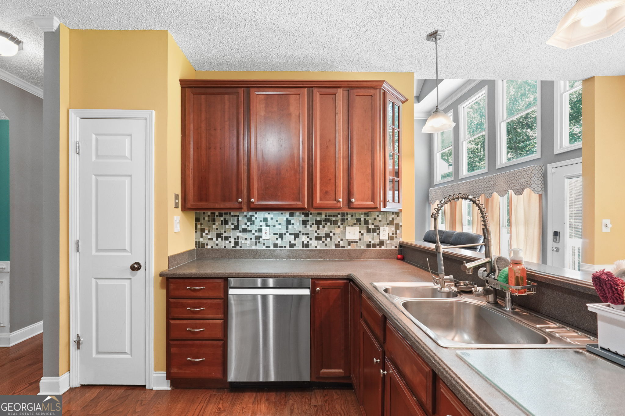 330 James Moore Circle Jackson, GA 30233 - Photo 7 of 31 a kitchen with granite countertop a sink and a stove next to a window