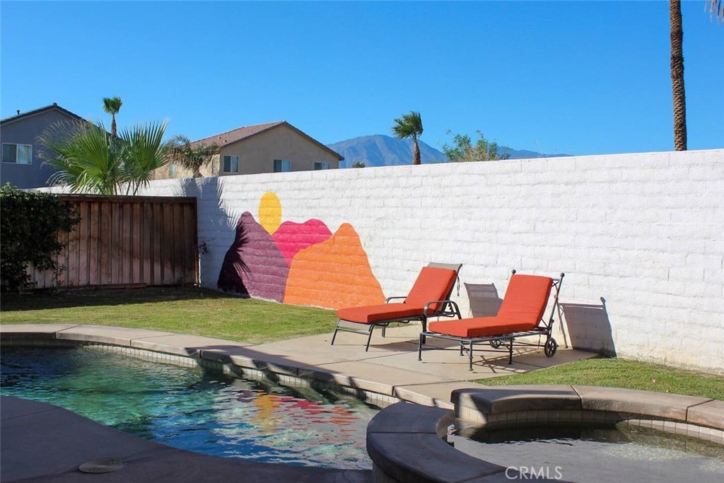 50157 Calle Tolosa Coachella, CA 92236 - Photo 1 of 24 a backyard of a house with table and chairs