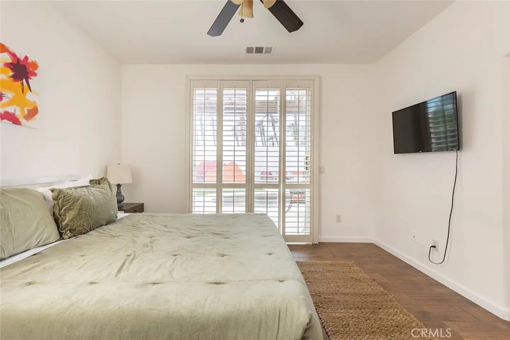 50157 Calle Tolosa Coachella, CA 92236 - Photo 11 of 24 a bedroom with a large bed and a flat tv screen