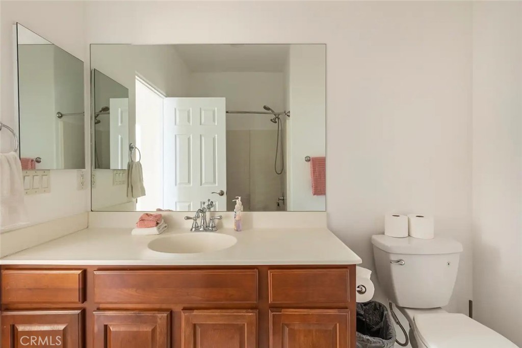 50157 Calle Tolosa Coachella, CA 92236 - Photo 12 of 24 a bathroom with a sink toilet and mirror