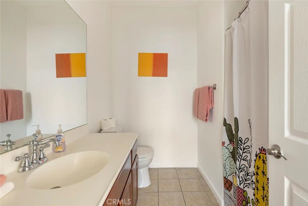 50157 Calle Tolosa Coachella, CA 92236 - Photo 13 of 24 a bathroom with a sink and a mirror