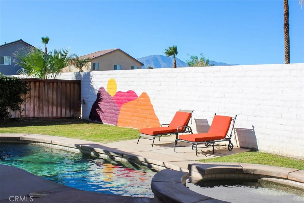 50157 Calle Tolosa Coachella, CA 92236 - Photo 21 of 24 a backyard of a house with outdoor seating