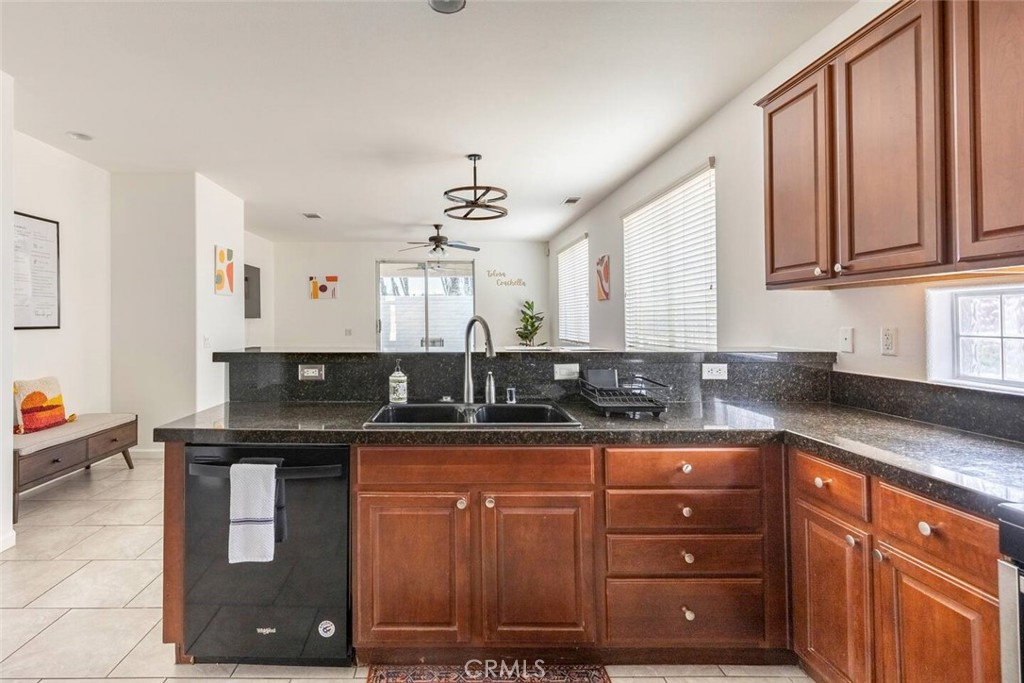 50157 Calle Tolosa Coachella, CA 92236 - Photo 3 of 24 a kitchen with granite countertop a sink and cabinets