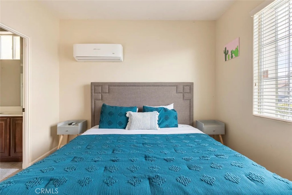 50157 Calle Tolosa Coachella, CA 92236 - Photo 8 of 24 a bed sitting in a bedroom next to a window