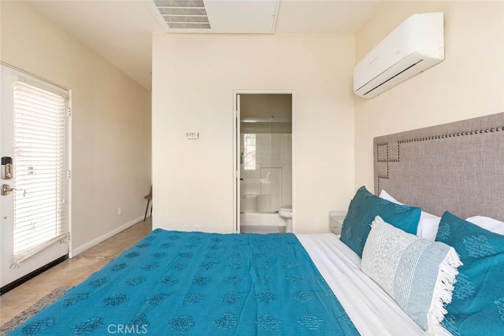 50157 Calle Tolosa Coachella, CA 92236 - Photo 9 of 24 a view of bedroom with furniture and wooden floor