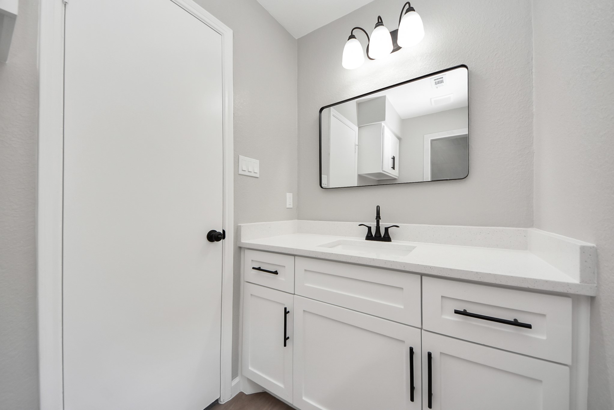 2402 Rolling Glen Drive Spring, TX 77373 - Photo 32 of 38 a bathroom with a sink vanity and mirror