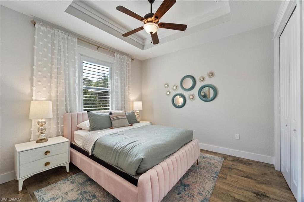 3554 McComb Lane Bonita Springs, FL 34134 - Photo 15 of 25 a bedroom with a bed and a window