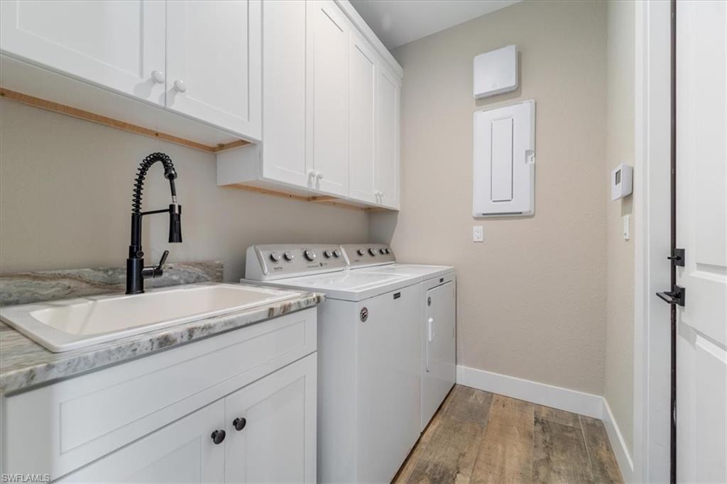 3554 McComb Lane Bonita Springs, FL 34134 - Photo 23 of 25 a view of a storage and utility room with a sink