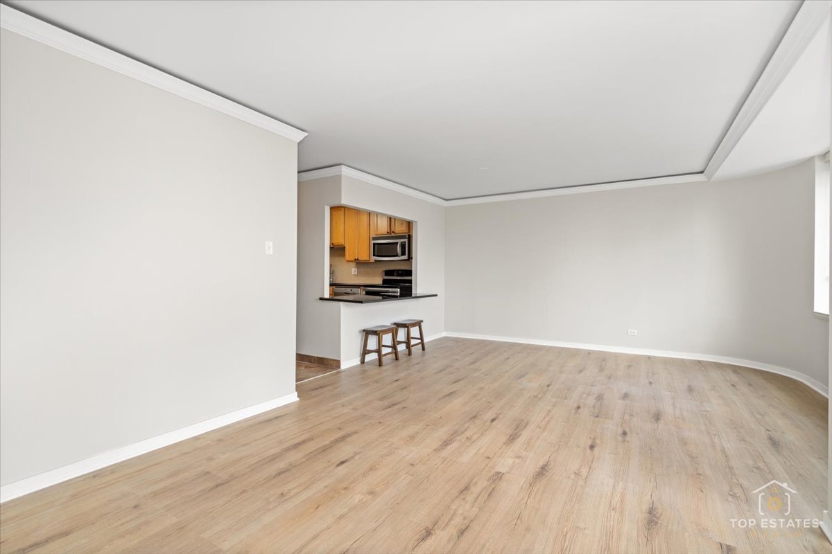 211 East Ohio Street, Unit 2806 Chicago, IL 60611 - Photo 12 of 33 a view of a livingroom with wooden floor