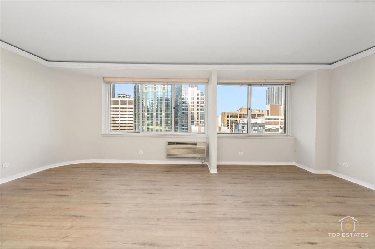 211 East Ohio Street, Unit 2806 Chicago, IL 60611 - Photo 20 of 33 a view of an empty room with a window
