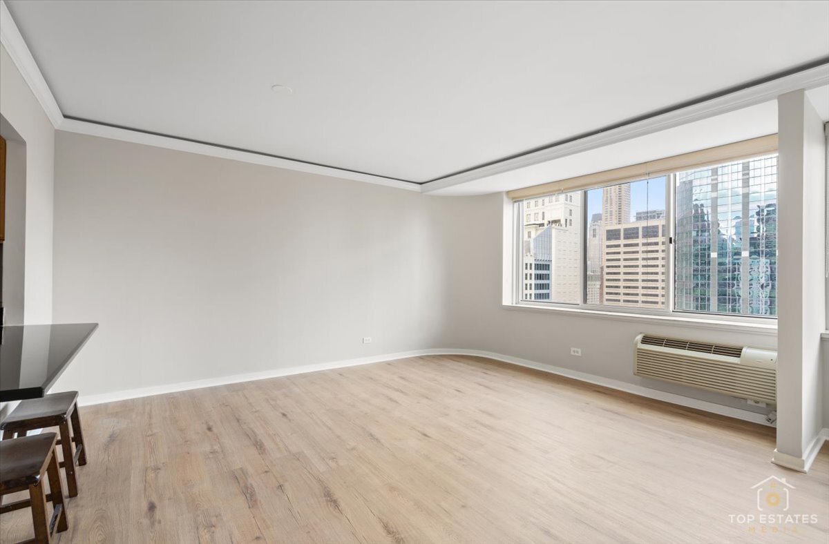 211 East Ohio Street, Unit 2806 Chicago, IL 60611 - Photo 2 of 33 a view of an empty room with a window