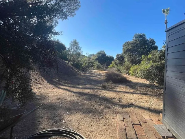 a view of a road with a yard