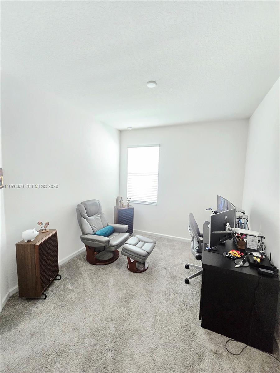 815 Kapi Drive Groveland, FL 34736 - Photo 17 of 30 a living room with furniture and a window