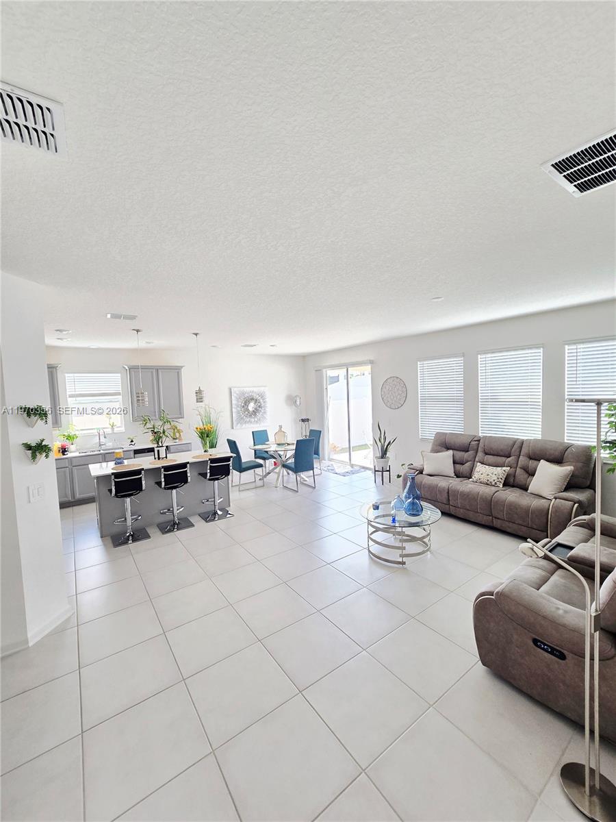 815 Kapi Drive Groveland, FL 34736 - Photo 18 of 30 a living room with furniture and white walls