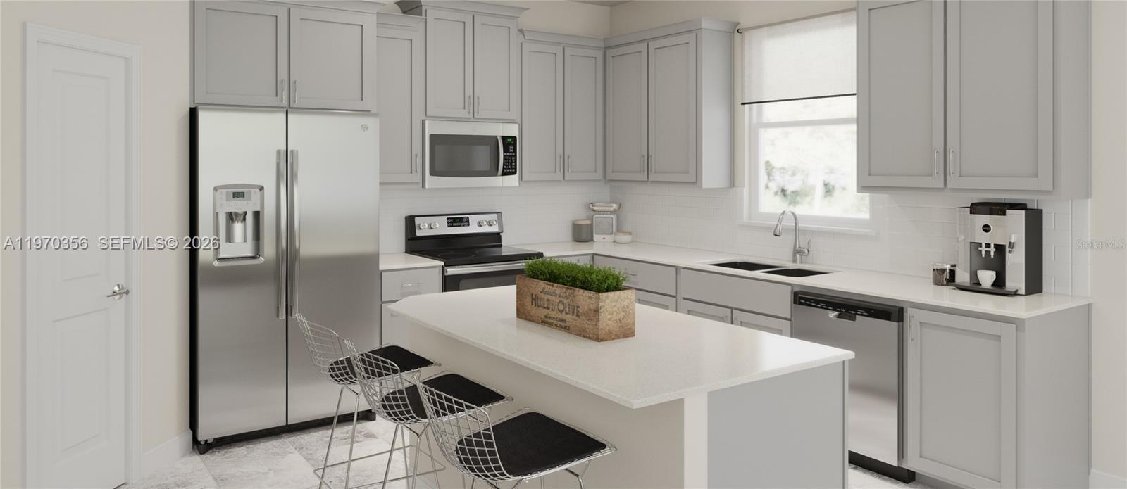 815 Kapi Drive Groveland, FL 34736 - Photo 2 of 30 a kitchen with stainless steel appliances a sink a refrigerator and cabinets