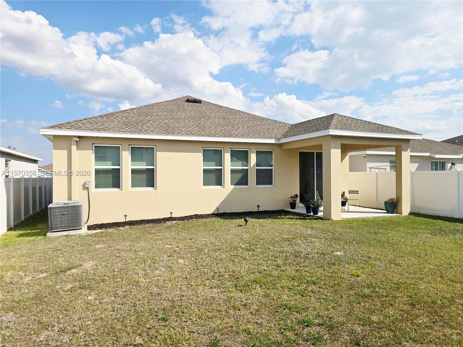 815 Kapi Drive Groveland, FL 34736 - Photo 29 of 30 a view of a house with a patio
