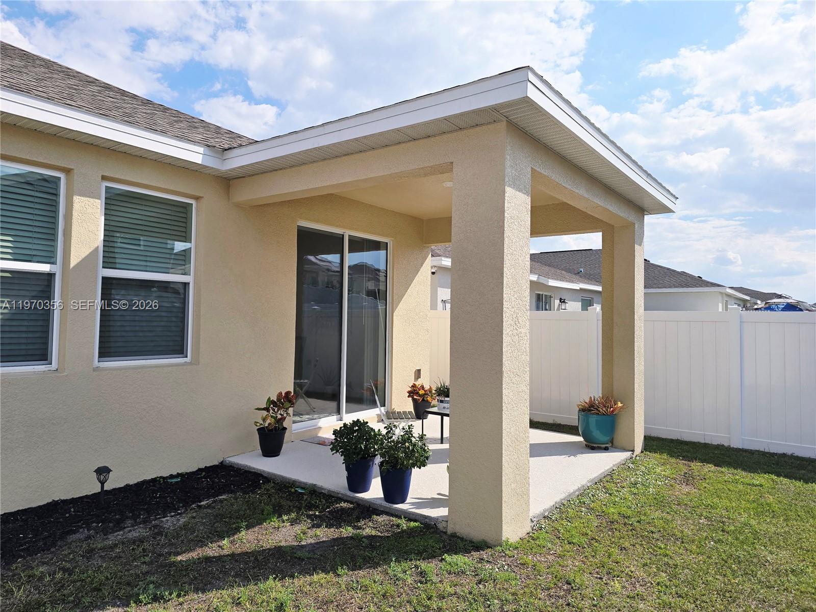 815 Kapi Drive Groveland, FL 34736 - Photo 30 of 30 a front view of a house with a yard