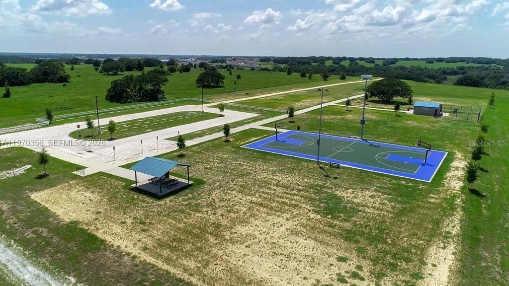 815 Kapi Drive Groveland, FL 34736 - Photo 4 of 30 an aerial view of a golf course with chairs