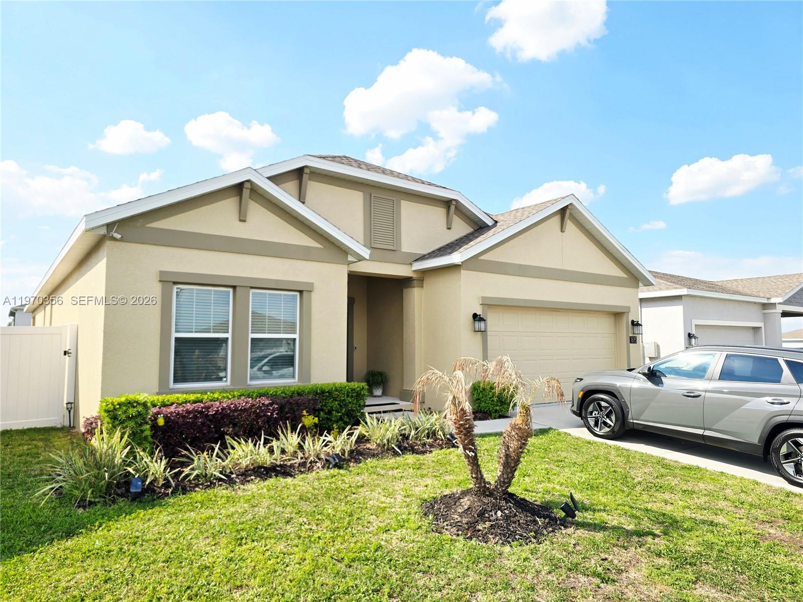 815 Kapi Drive Groveland, FL 34736 - Photo 7 of 30 a front view of a house with garden