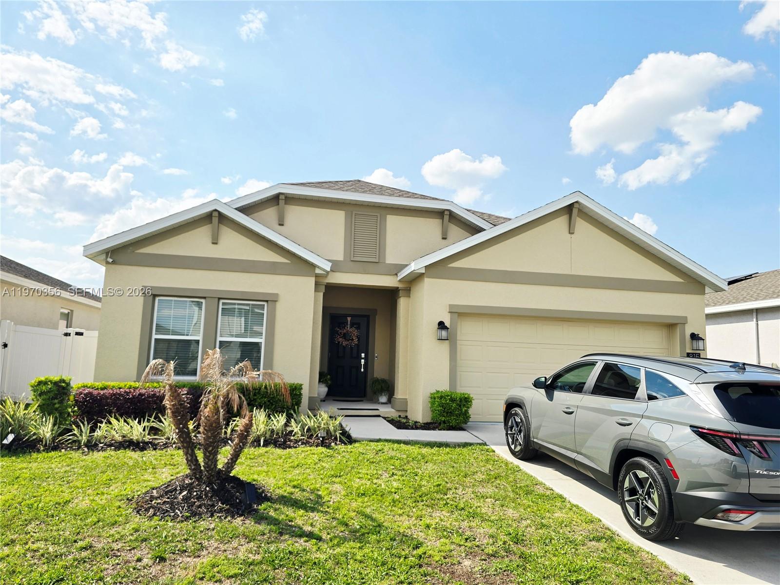 815 Kapi Drive Groveland, FL 34736 - Photo 8 of 30 a front view of a house with garden