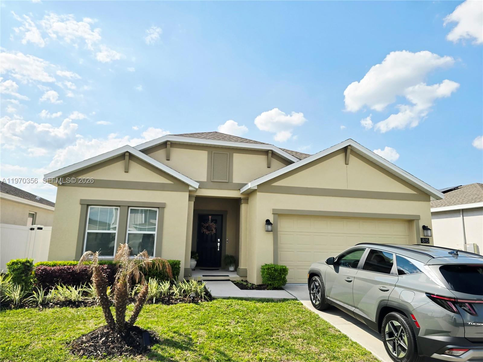 815 Kapi Drive Groveland, FL 34736 - Photo 9 of 30 a front view of a house with garden