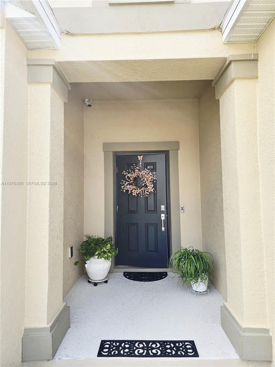 815 Kapi Drive Groveland, FL 34736 - Photo 10 of 30 a view of an entryway door and a bench