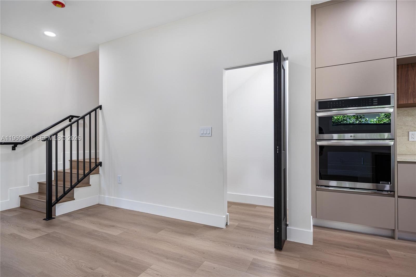 281 Northwest 52nd Street, Unit 281 Miami, FL 33127 - Photo 11 of 52 a view of a hallway with entryway