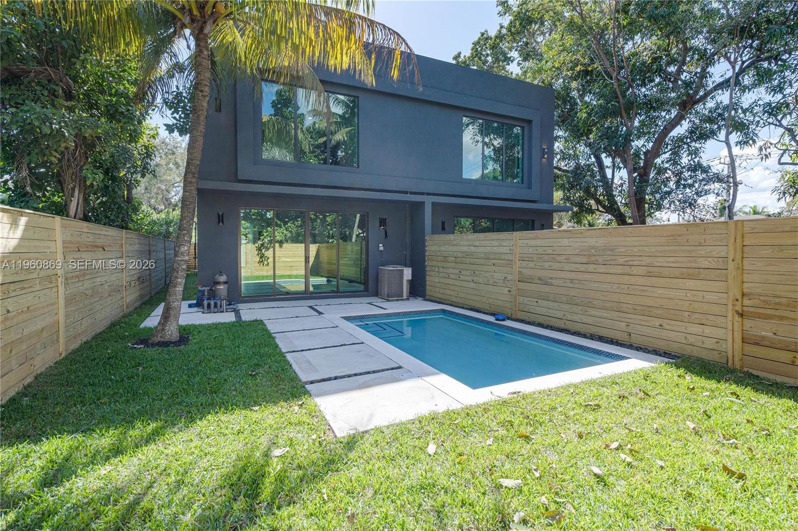 281 Northwest 52nd Street, Unit 281 Miami, FL 33127 - Photo 24 of 52 a view of a back yard of the house