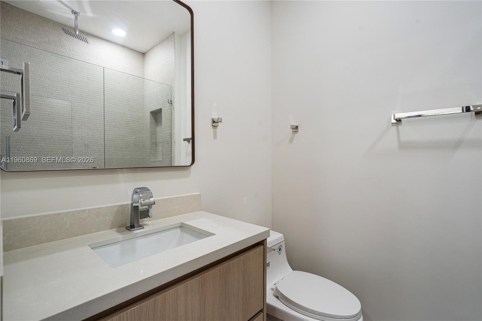 281 Northwest 52nd Street, Unit 281 Miami, FL 33127 - Photo 28 of 52 a bathroom with a sink toilet and mirror