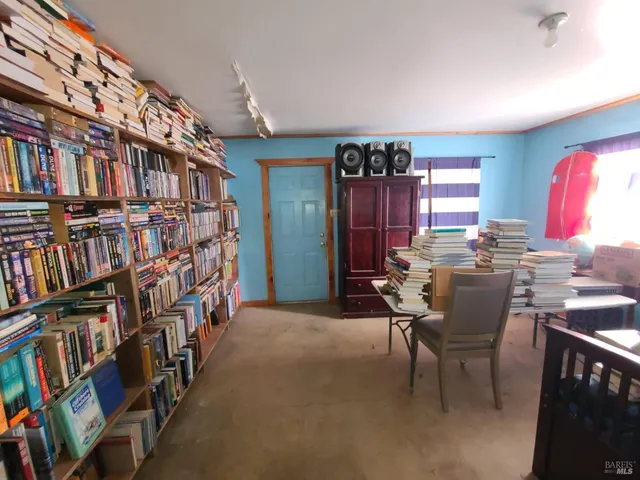 a view of a workspace with furniture and toys