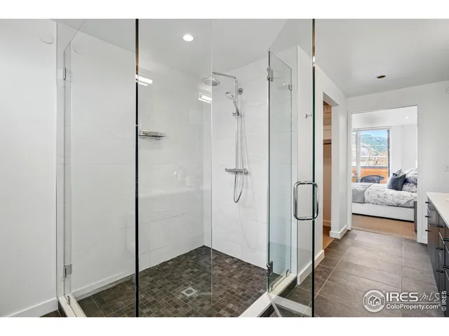 a bathroom with a shower and a sink