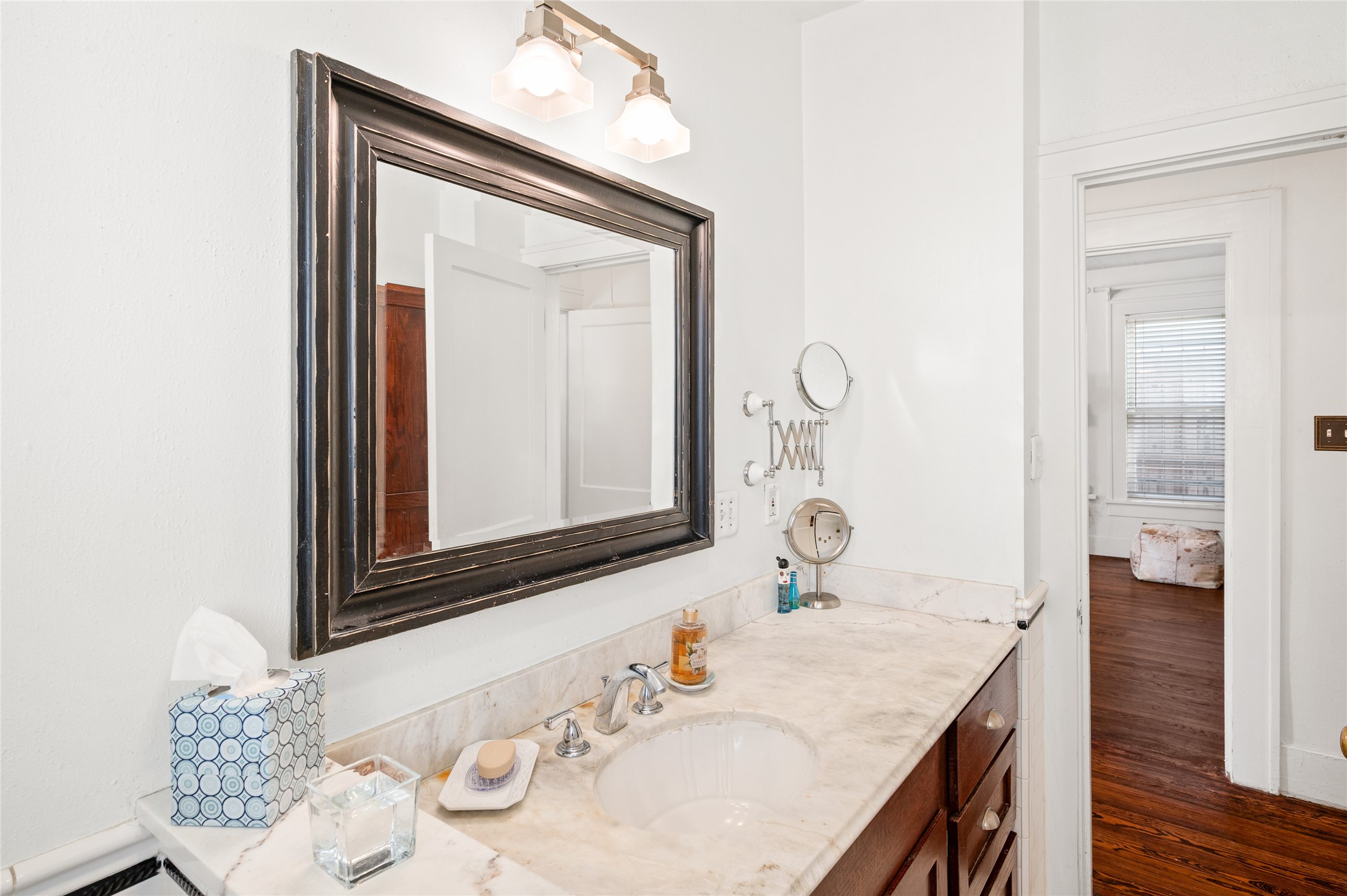 2503 Park Street Houston, TX 77098 - Photo 16 of 23 a bathroom with a granite countertop sink and a mirror