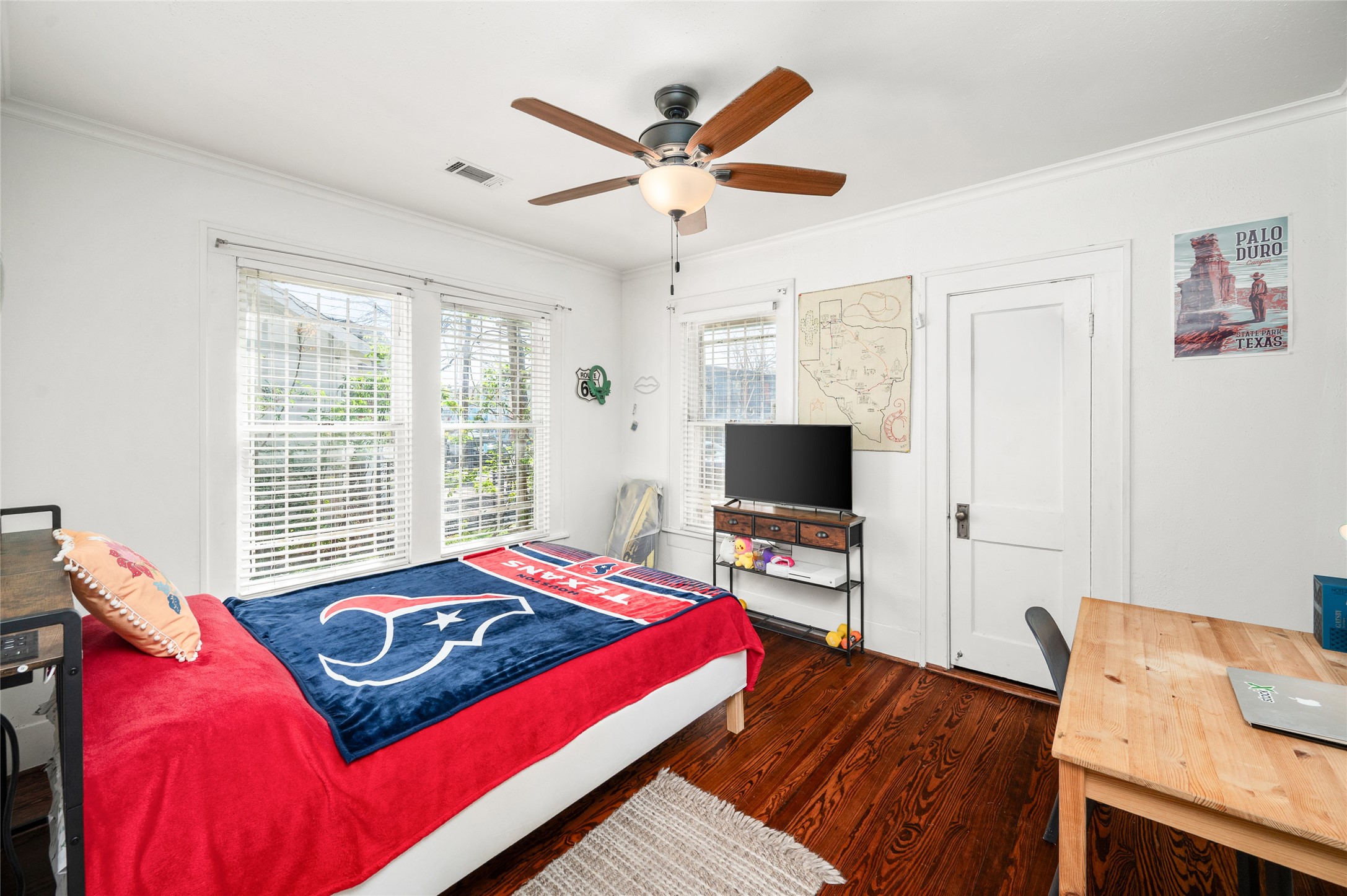 2503 Park Street Houston, TX 77098 - Photo 18 of 23 a bedroom with a bed and a flat screen tv